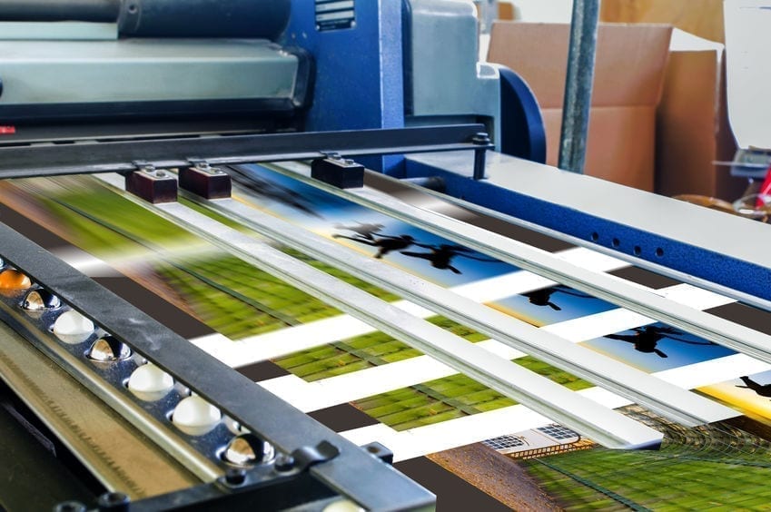 Close up of an offset printing machine during production